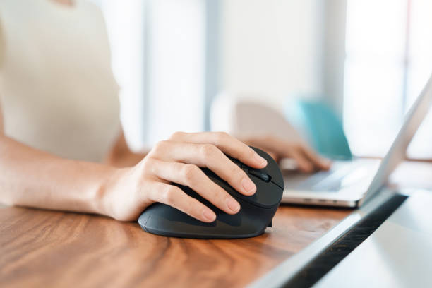 istock woman hand using computer ergonomic mouse, prevention wrist pain because working long time. De Quervain s tenosynovitis, Intersection Symptom, Carpal Tunnel Syndrome or Office syndrome concept 1423502194