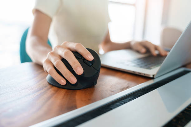 istock woman hand using computer ergonomic mouse, prevention wrist pain because working long time. De Quervain s tenosynovitis, Intersection Symptom, Carpal Tunnel Syndrome or Office syndrome concept 1423502195