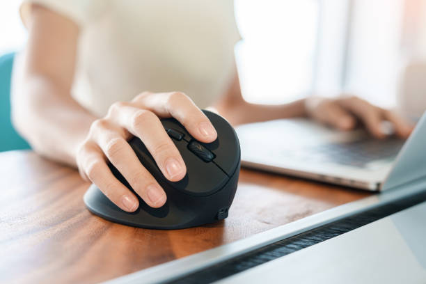 istock woman hand using computer ergonomic mouse, prevention wrist pain because working long time. De Quervain s tenosynovitis, Intersection Symptom, Carpal Tunnel Syndrome or Office syndrome concept 1423502251