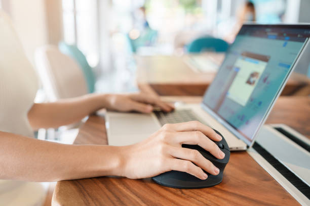istock woman hand using computer ergonomic mouse, prevention wrist pain because working long time. De Quervain s tenosynovitis, Intersection Symptom, Carpal Tunnel Syndrome or Office syndrome concept 1423502254