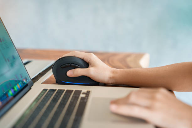 istock woman hand using computer ergonomic mouse, prevention wrist pain because working long time. De Quervain s tenosynovitis, Intersection Symptom, Carpal Tunnel Syndrome or Office syndrome concept 1423502369