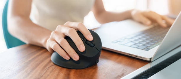 istock woman hand using computer ergonomic mouse, prevention wrist pain because working long time. De Quervain s tenosynovitis, Intersection Symptom, Carpal Tunnel Syndrome or Office syndrome concept 1423502370