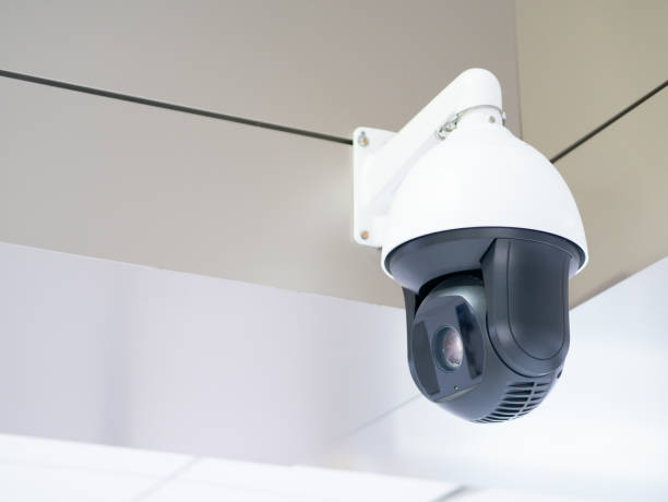 istock Security CCTV camera or surveillance system in office building background of technician repairing the car in garage,Closed-circuit television,use video transmit a signal to a specific place 1423503462