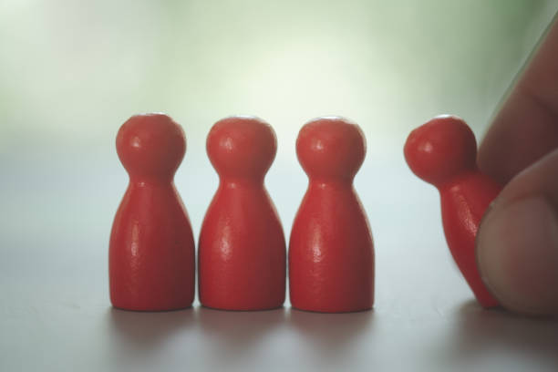 istock Hand picking on one talent, Human resources concept. Stand out from the crowd. 1423506561