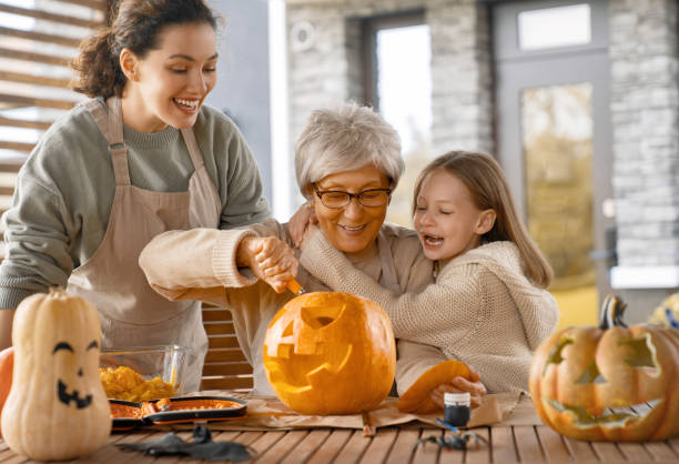 istock family preparing for Halloween 1423510877