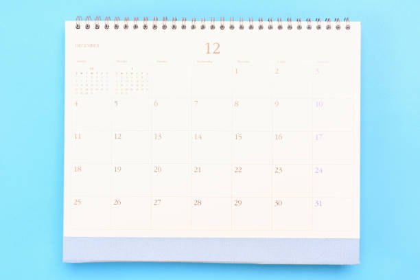 istock White calendar for 2023 on blue background close-up, planning concept. 1423513205