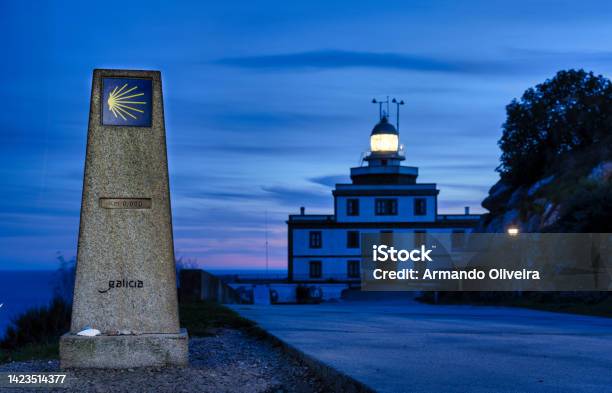 Mile Zero Of The Camino De Santiago In Finisterre Galicia With The Lighthouse In The Background Stock Photo - Download Image Now