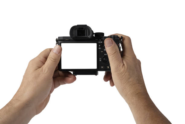 istock a man holds a mirrorless camera with his hands on a transparent background 1423523028