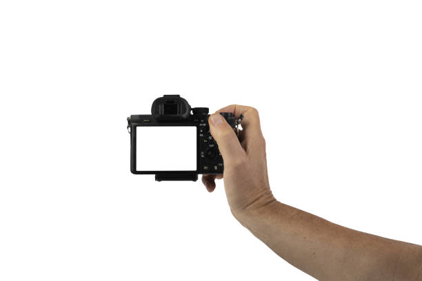istock a mirrorless camera in a male hand on a transparent background 1423523051