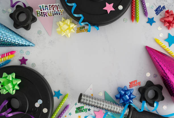 istock Birthday flat lay composition with gym dumbbells, decorations and copy space. 1423523600