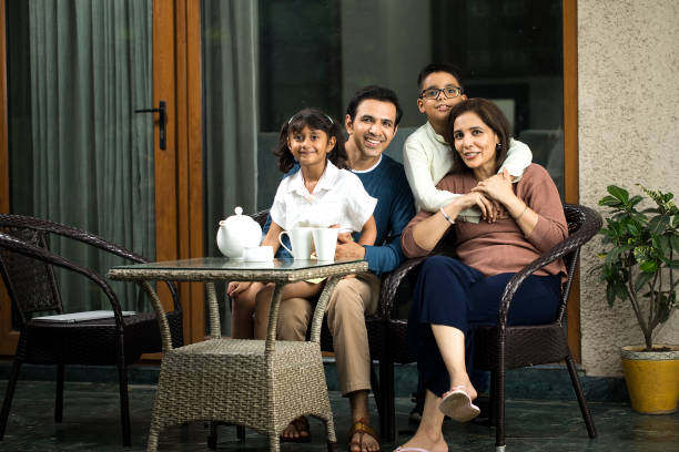 istock Happy family spending leisure time at terrace 1423525262