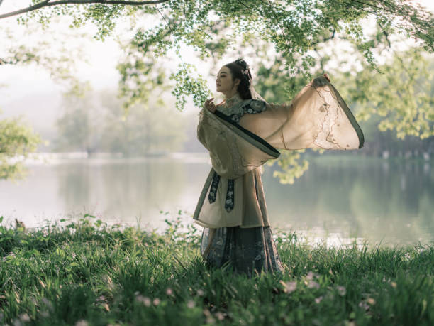 Girl wearing ancient Chinese clothes in beautiful park