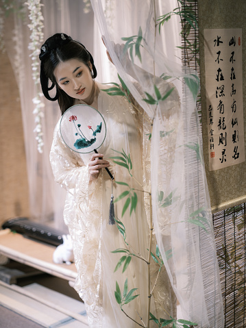 Girl wearing ancient Chinese clothes indoor