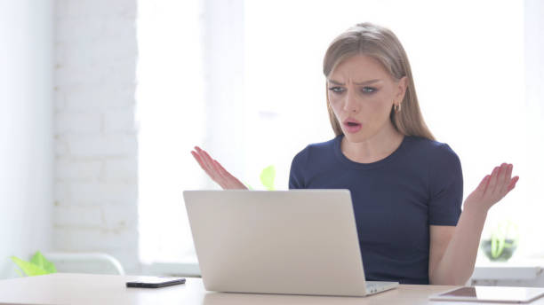 istock Woman Reacting to Loss While using Laptop 1423528322