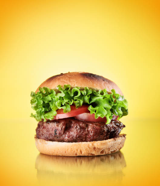 istock Homemade hamburger with large beef cutlet and fresh vegetables 1423529712
