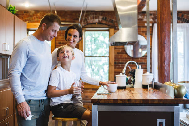 istock Small family having bonding moments while hanging out in the kitchen 1423530225