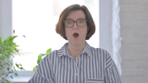 istock Surprised Senior Woman Wondering in Awe 1423533513