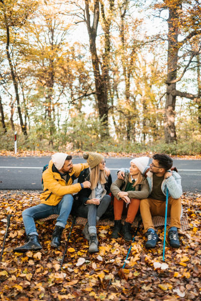istock Sitting by the road and resting after exhausting hiking 1423534746