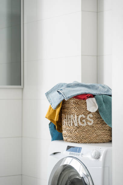 istock dirty clothes in basket on washing machine indoors 1423535082