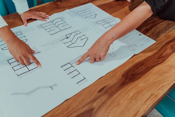 istock Diversity group working together on architectural project in office interior, young male and female creative graphic designers collaborating during brainstorming using modern technology 1423538537