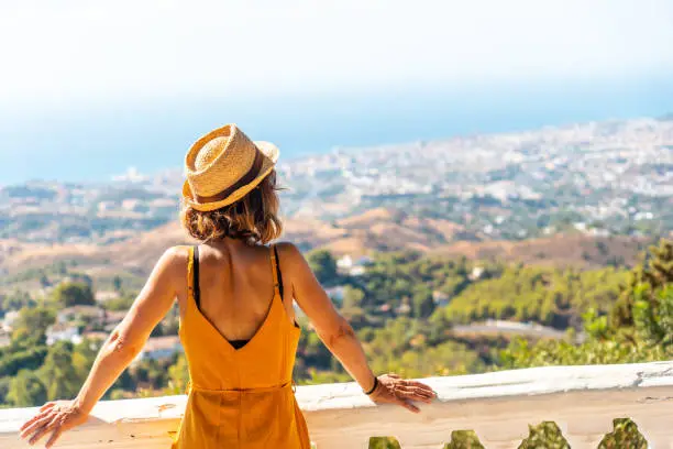 A young tourist looking from the viewpoint in the municipality of Mijas in Malaga. Andalusia