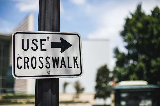 “Use crosswalk” sign on city street, Atlanta, Georgia
