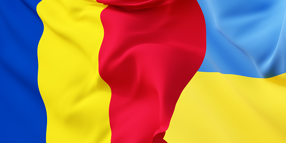 Romanian and Ukrainian flags flying in the wind. Romania stand with Ukraine. 3D rendered image.