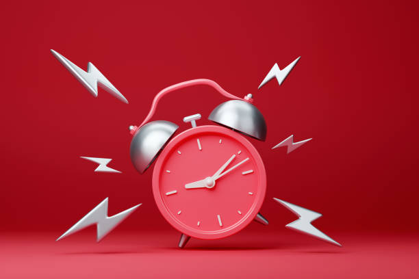 istock Red vintage ringing alarm clock with silver lightings 1423540467