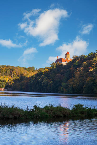 istock Quiet wide river. There are green trees around the river. Sky with dramatic clouds. Brno Dam - Czech Republic. 1423540685