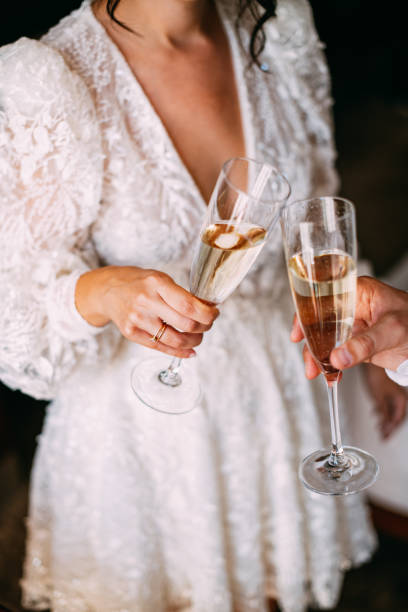 bride and groom celebrate their marriage with champagne - wedding champagne table wedding reception imagens e fotografias de stock