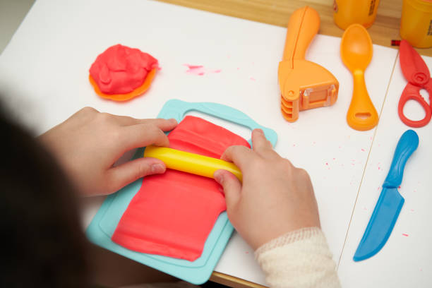 istock kid play clay ,safety toy on table with toy 1423543143