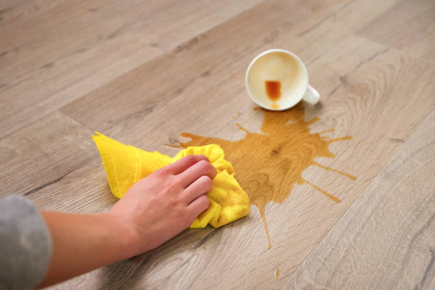 istock A cup of coffee fell on laminate, coffee spilled on floor. 1423543435
