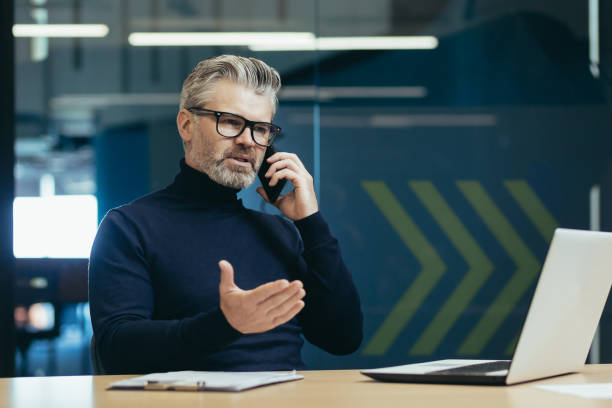 istock Senior and mature boss businessman working inside office building, man thoughtful 1423544128