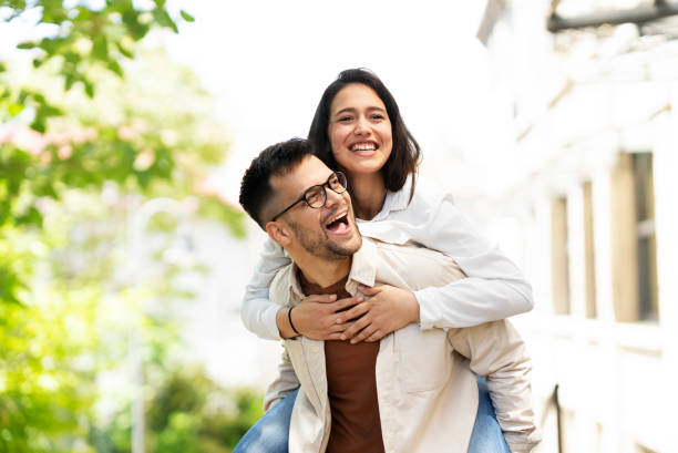istock Boyfriend and girlfriend having fun at the park. 1423544295