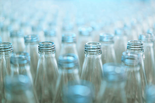 Cropped shot of a woman holding a box with recycled glass jars