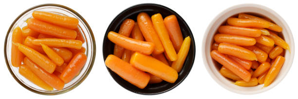 istock Boiled canned carrots in a bowl isolated on white background 1423545069