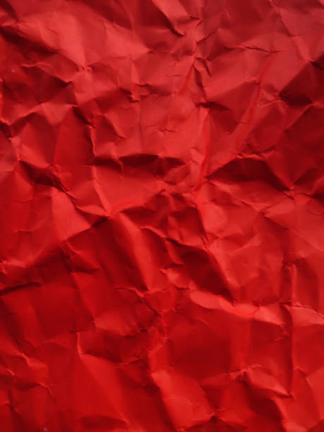 istock Crumpled red paper for backgound or texture 1423545391
