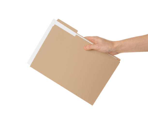 istock Woman holding yellow file with documents on white background, closeup 1423550068