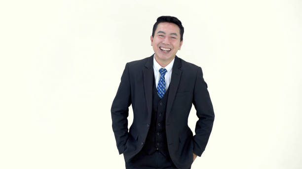 Young minority guy in a tuxedo isolated on white