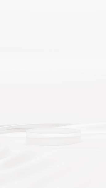 istock Clear glass pedestal (vertical) on white background and cloth 1423552059