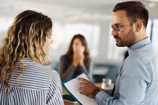 istock Business colleagues talking about reports on a meeting in the office. 1423552098
