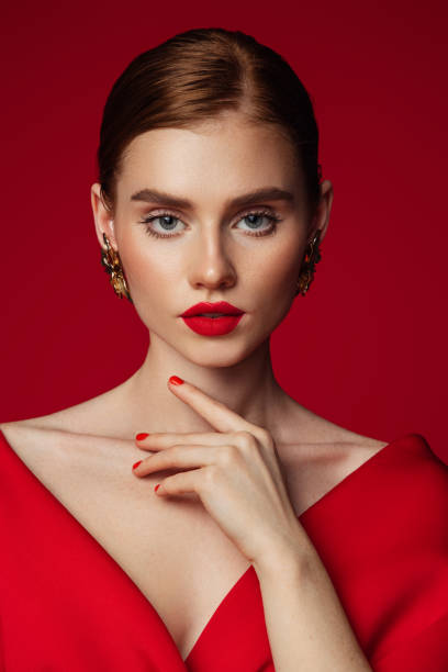 istock Beautiful emotional woman with bright make-up and red lips 1423552205