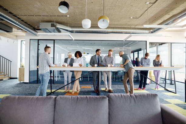 istock Multi-tasking business people working in a modern office. 1423552726