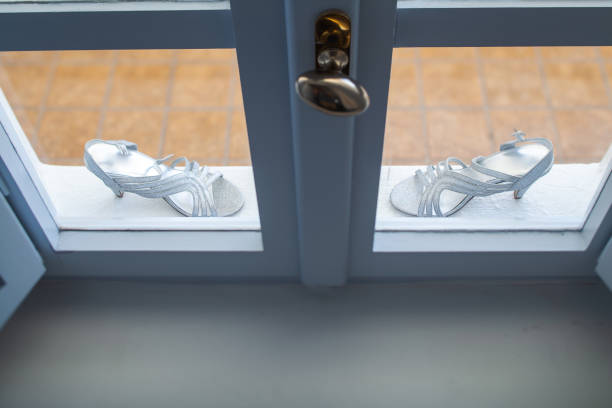 istock Shiny wedding shoes on a stone windowsill 1423553160
