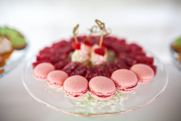 istock Pink macaroons in a glass plate on a wedding table 1423553449
