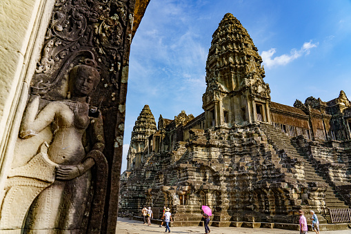 Cambodia. Siem Reap Province. A Devata sculpture at Angkor Wat (Temple City). A Buddhist and temple complex in Cambodia and the largest religious monument in the world