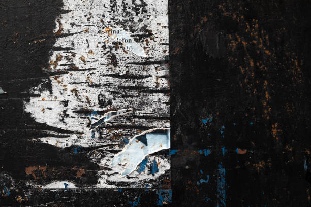 istock Torn street poster on a black wall background 1423555826