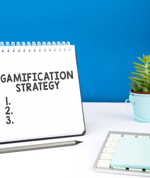 istock Handwriting text Gamification Strategy. Business idea use Rewards for Motivation Integrate Game Mechanics 1423556432