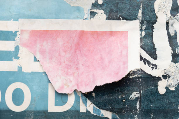 istock Torn and ripped old street poster background 1423556478