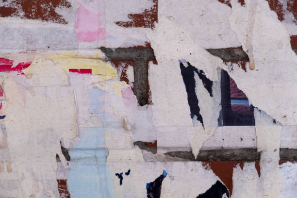 istock Torn and ripped old street poster background 1423556595